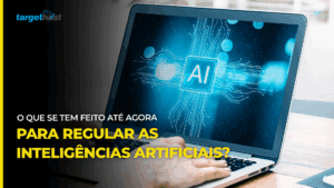 Computador com a palavra AI (inteligência artificial em inglês) na tela e o seguinte texto: o que tem sido feito até agora para regular as inteligências artificiais?